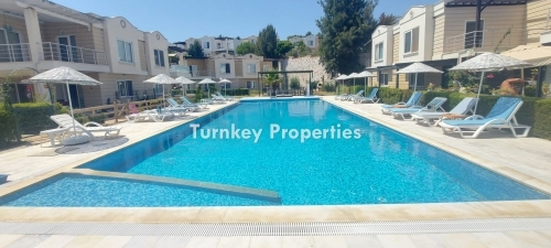 2+1 Upper Floor Apartment for Sale in Guvercinlik, Bodrum, Modern, With Shared Pool